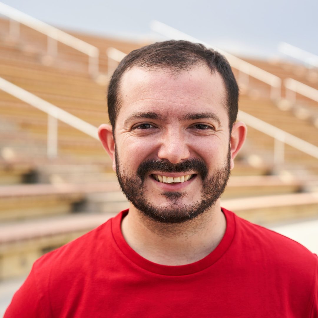 Outdoor portrait of a man looking at the camera smiling